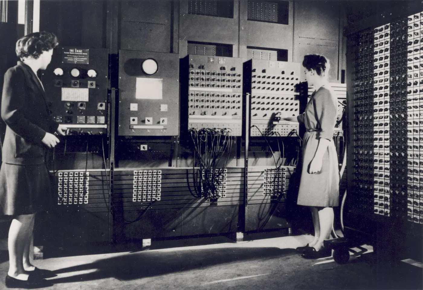 Two ENIAC programmers setting up the machine for its first public demonstration, 1946