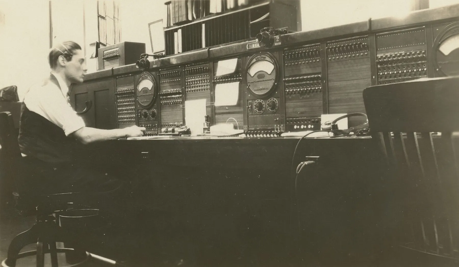 A switchboard operator at a telephone exchange in 1930