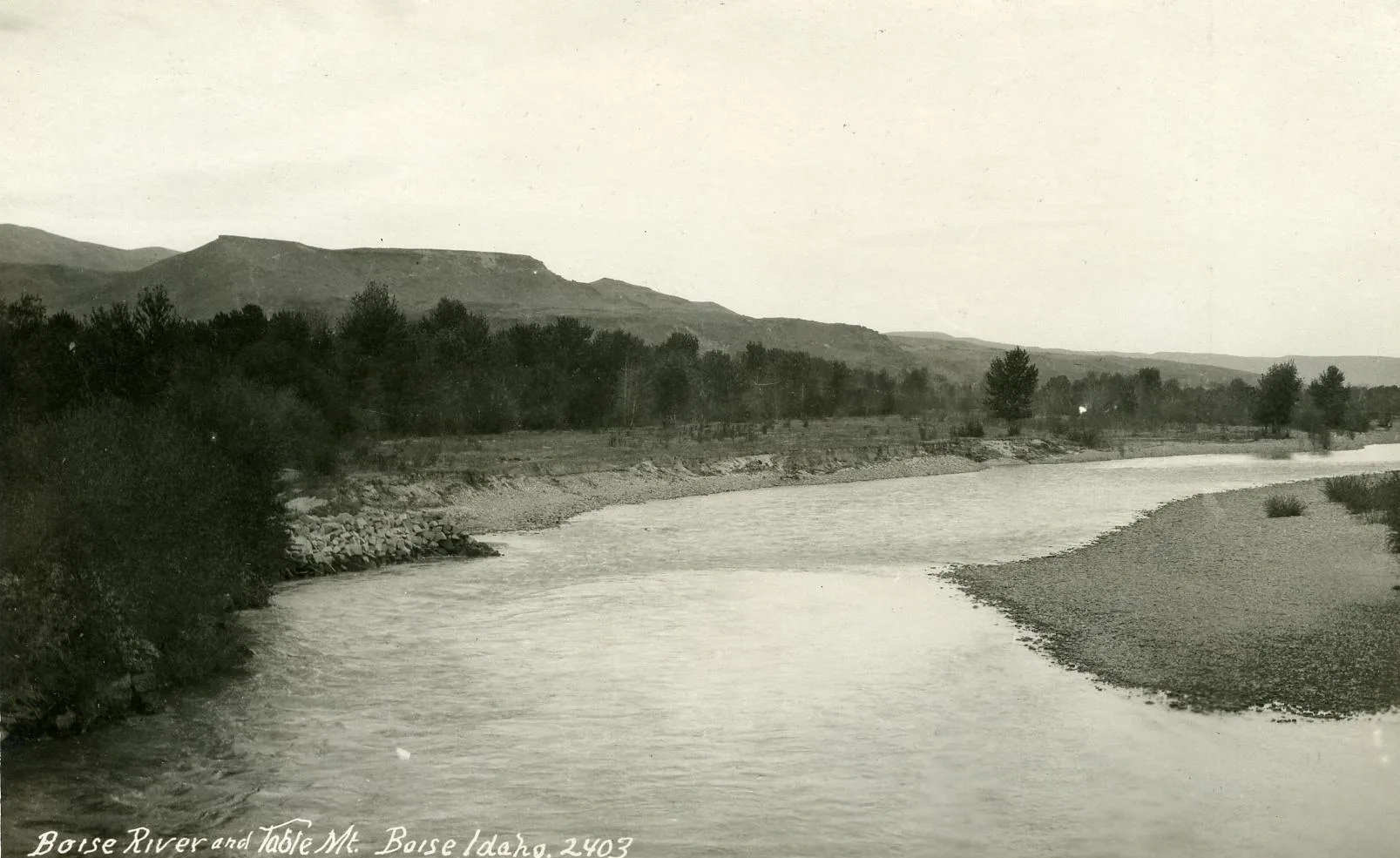 An early postcard of the Boise River bending below Table Mountain