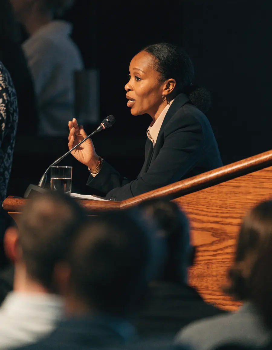 Dana Okafor speaking at a lectern