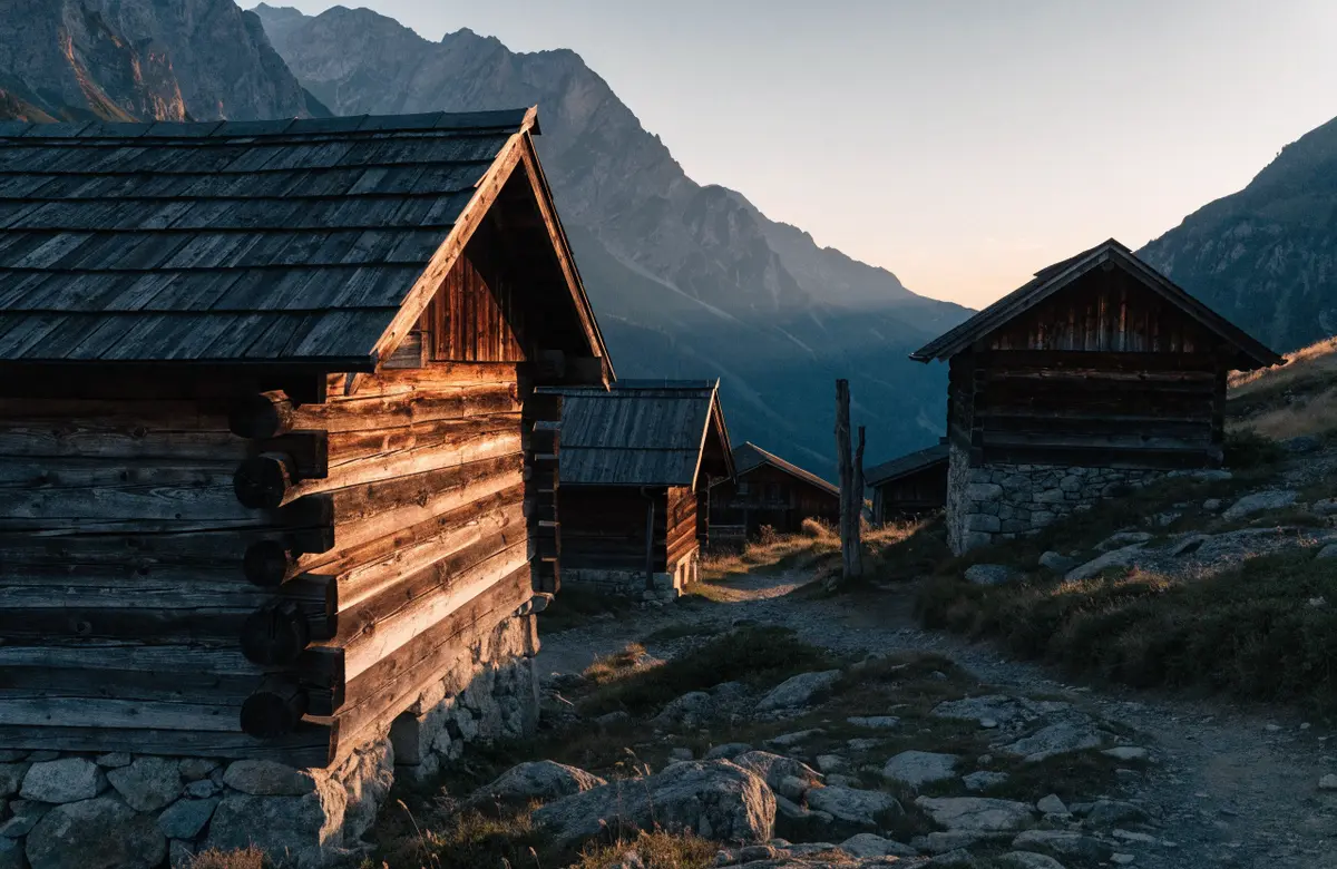 Wooden houses on a steep mountainside at dusk